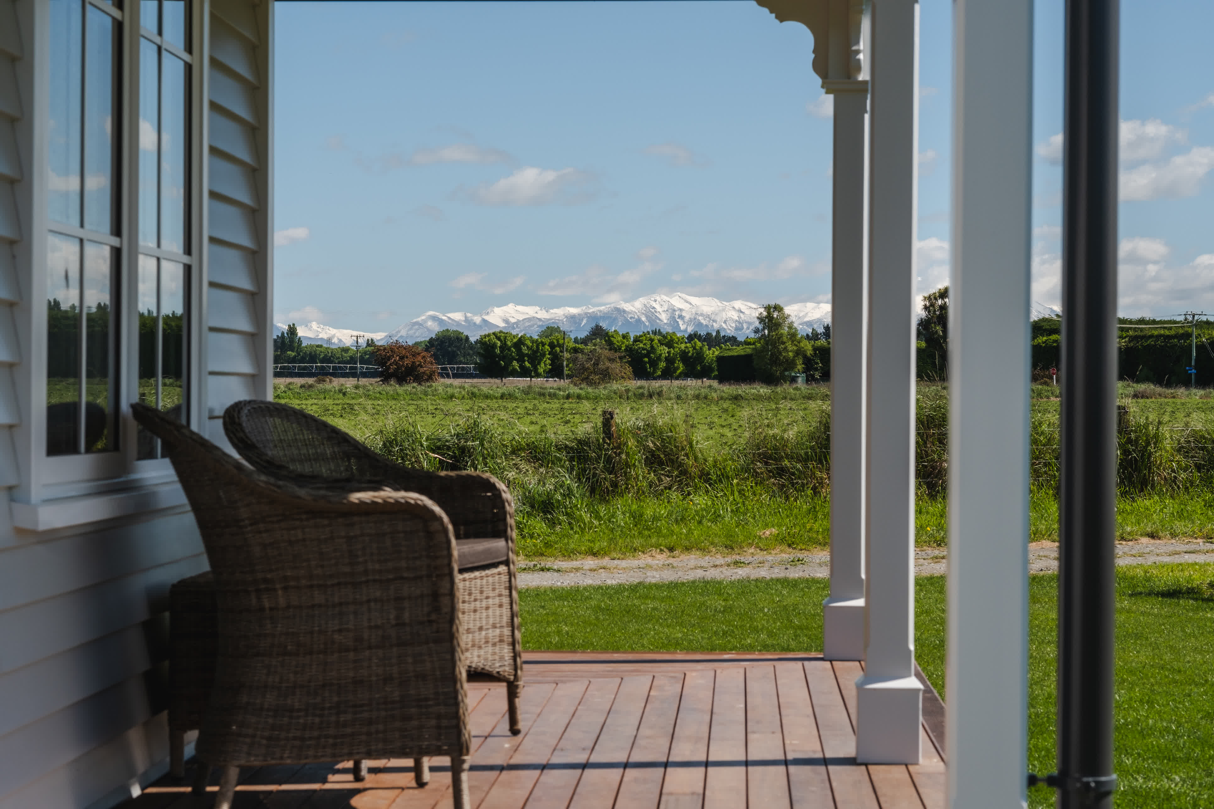 Cottage verandah with mountains in the background